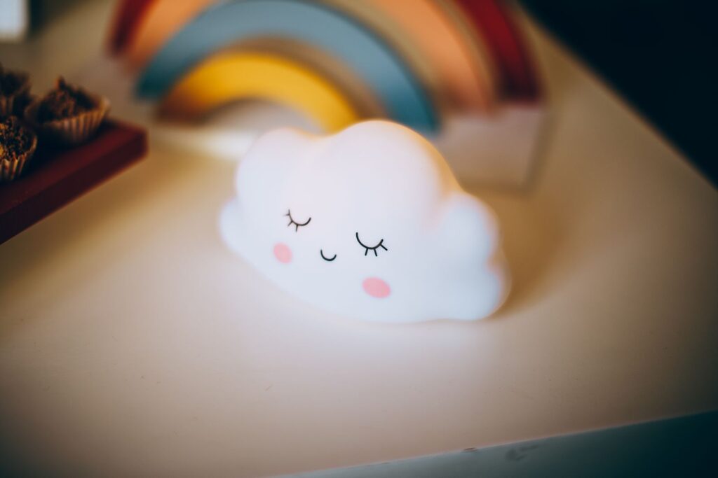 Smiling cloud-shaped night light glowing softly