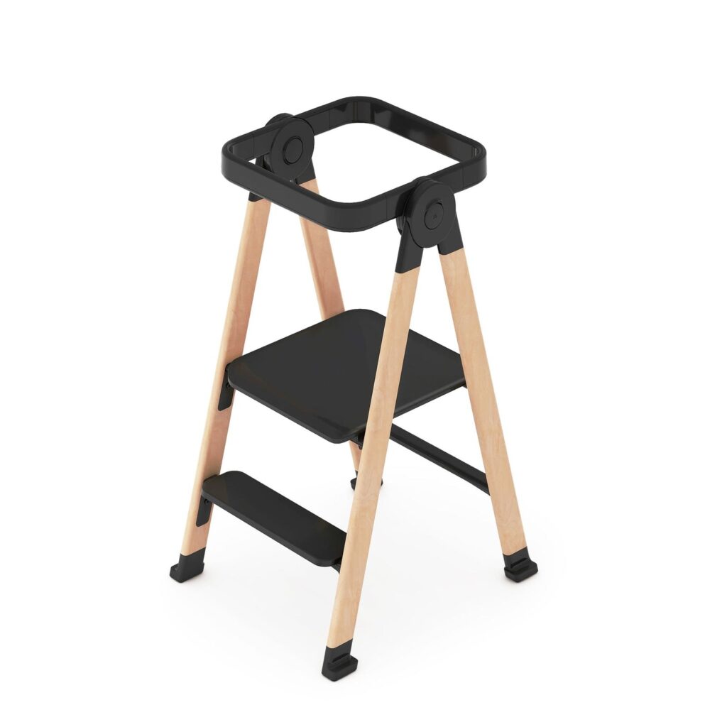Guidecraft Kitchen Helper FLEX toddler tower with a black frame and wooden legs