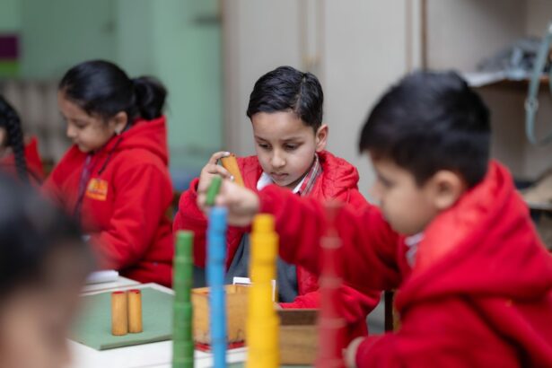 Children concentrating while building towers from colorful wooden blocks