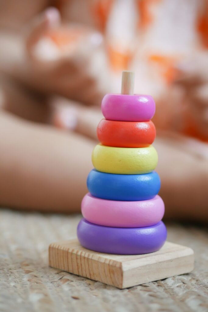 Rainbow stacking ring toy with graduated colorful rings